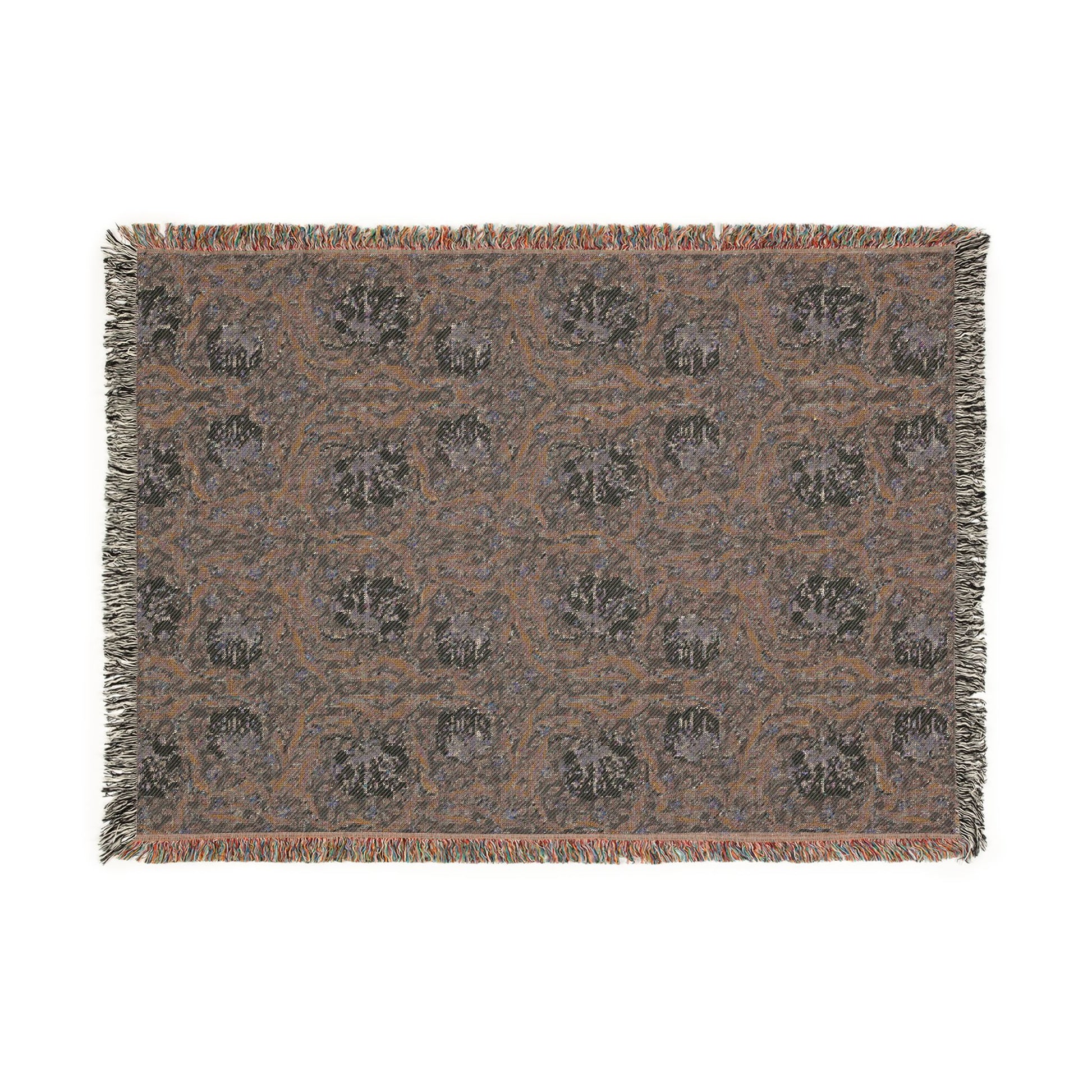 Patterned throw blanket with fringe on a white background