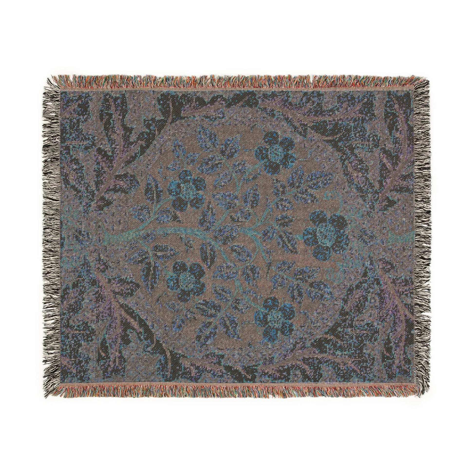 Floral patterned throw blanket with fringe on a white background