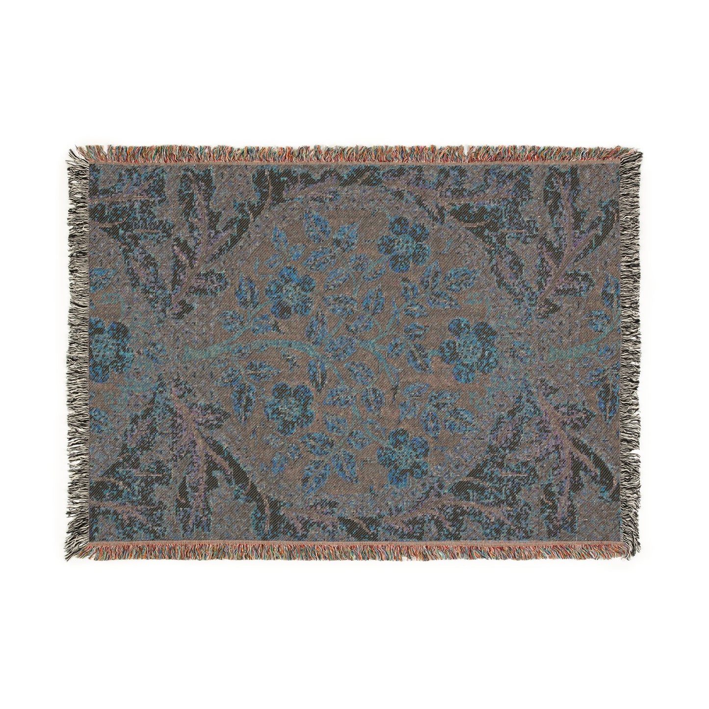A woven cotton blanket with a floral William Morris & Co pattern in shades of blue, beige, and yellow, featuring colourful fringed edges.