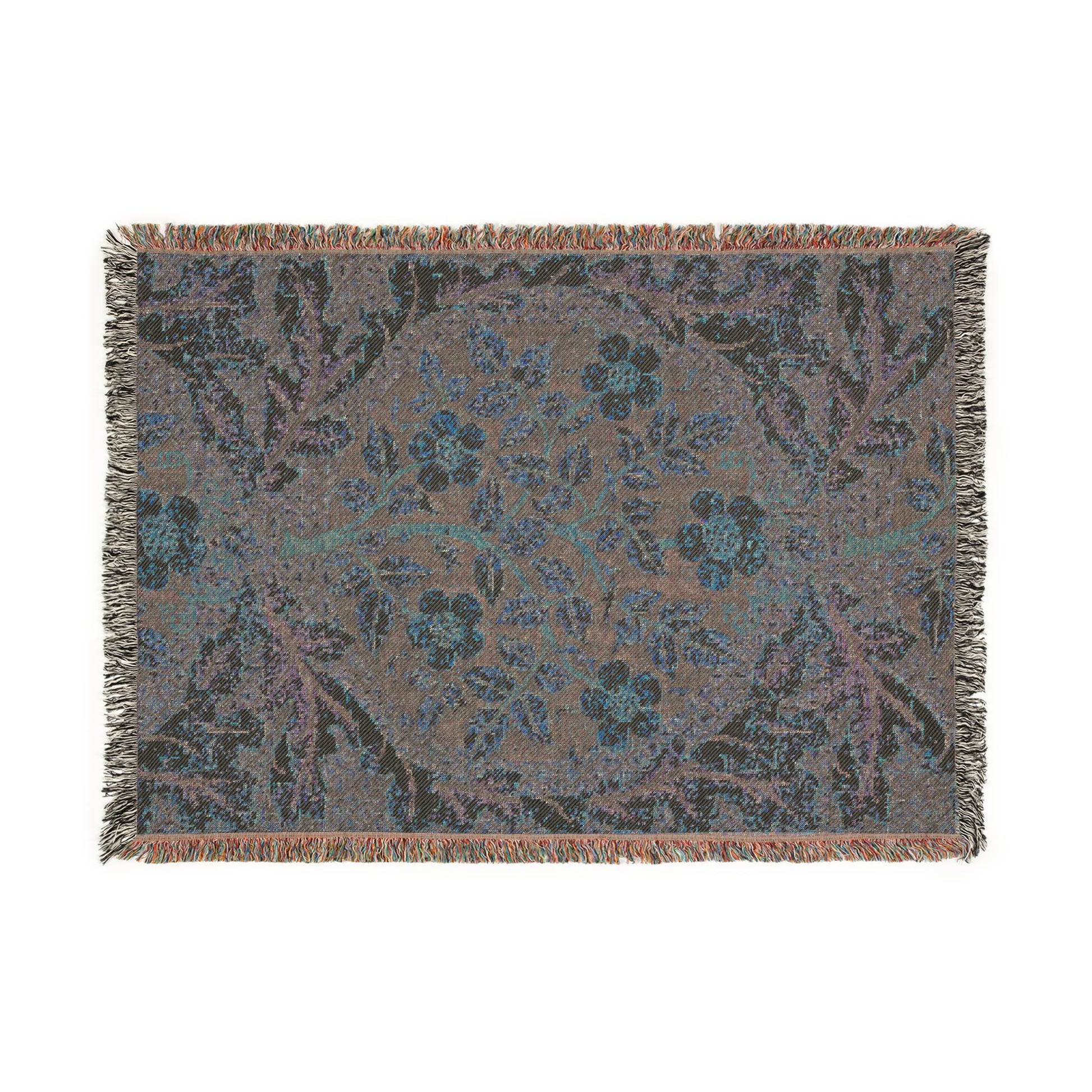 Floral patterned throw blanket with fringe on a white background