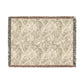 A woven cotton blanket with a floral pattern in shades of green and beige, with a colorful fringed edge.