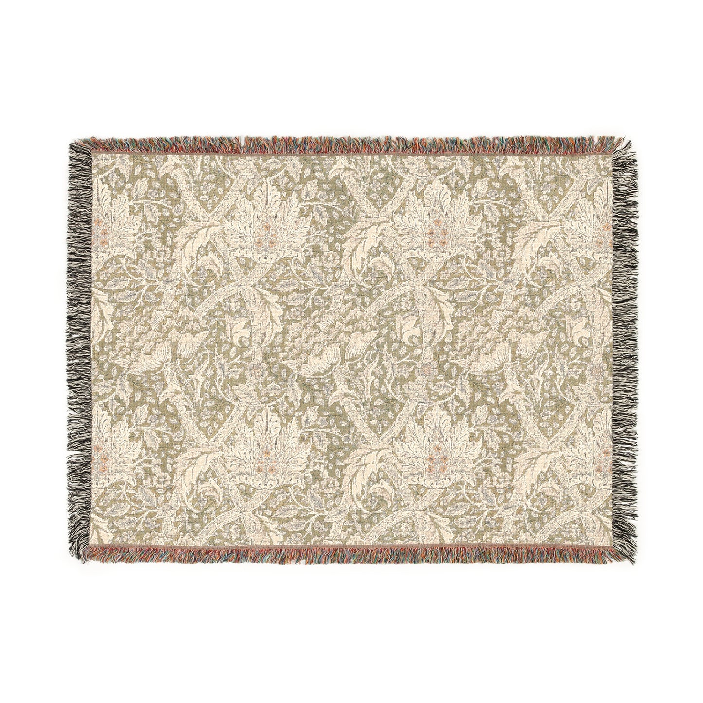 A woven cotton blanket with a floral pattern in shades of green and beige, with a colorful fringed edge.