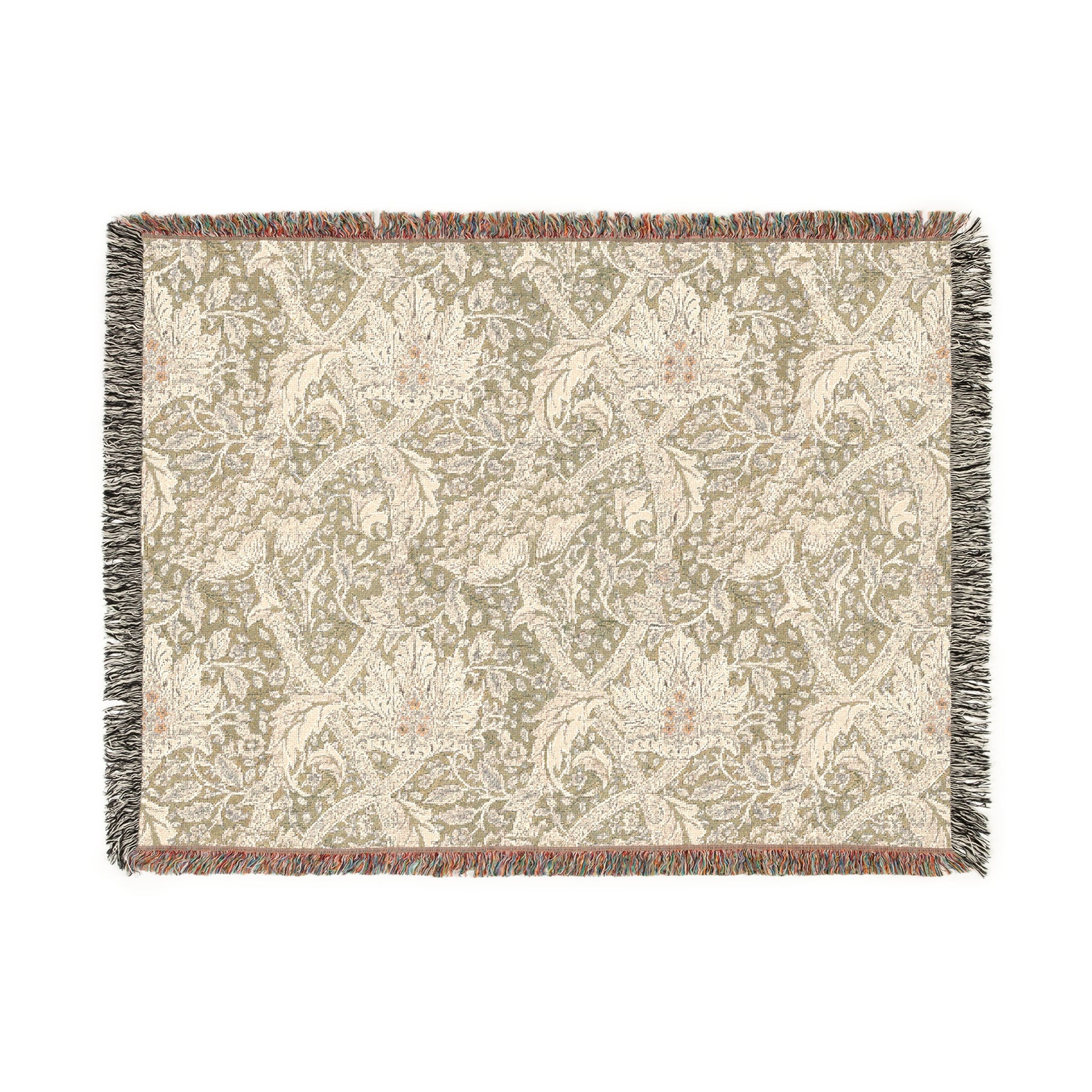A woven cotton blanket with a floral pattern in shades of green and beige, with a colorful fringed edge.