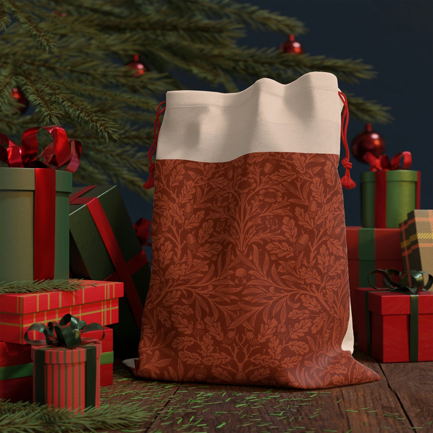 A rectangular Christmas gift bag with a vintage design, featuring an embossed acorn and oak leaf pattern on a beige background, finished with a red drawstring at the top.