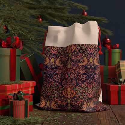 A rectangular Christmas-themed linen drawstring bag with a vintage floral and birds pattern, primarily in red and green colours, inspired by the art of William Morris.