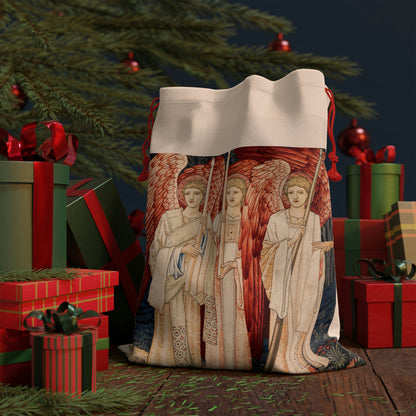 A linen drawstring gift bag with a Christmas design featuring angels and holiday motifs.