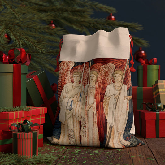 A linen drawstring gift bag with a Christmas design featuring angels and holiday motifs.