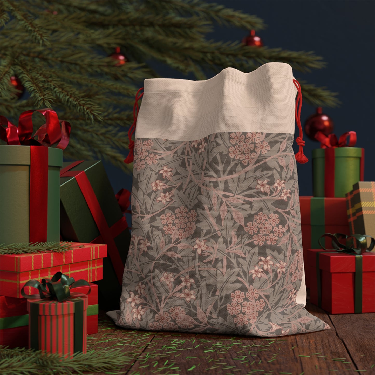 A rectangular Christmas Santa sack with a floral William Morris & Co pattern in mauve, beige, and gray colours, featuring a drawstring at the top.