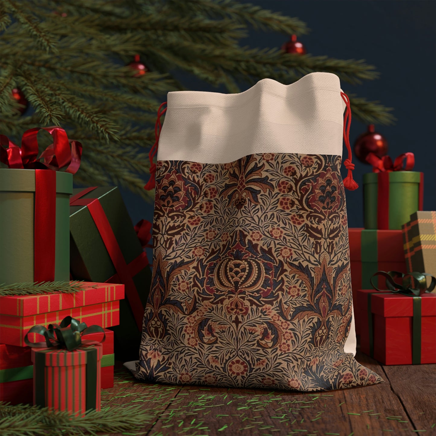 A rectangular Christmas linen gift bag with a William Morris & Co floral pattern and a red drawstring.