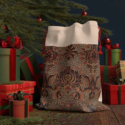 A rectangular Christmas linen gift bag with a William Morris & Co floral pattern and a red drawstring.