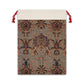 A rectangular Christmas linen gift bag with a William Morris & Co floral pattern and a red drawstring.