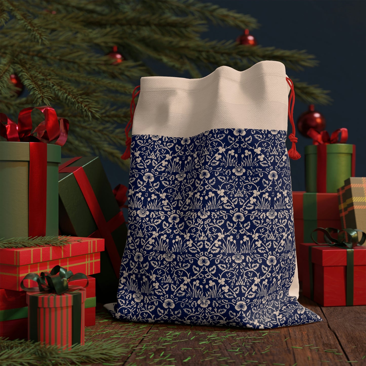 A beige linen drawstring gift bag with a blue floral pattern inspired by William Morris designs.