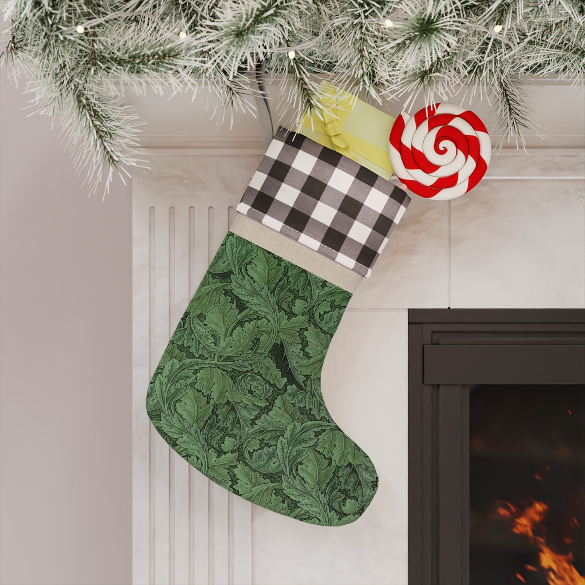 A green Christmas stocking with a black and white checkered top cuff and a wooden hanging loop in a William Morris & Co pattern.