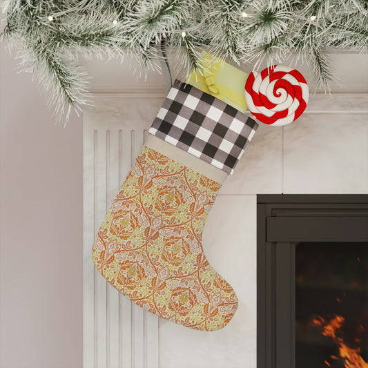 A one-sided print Christmas stocking with a red and black plaid design and a William Morris & Co floral pattern in orange and green tones. It has a beige background and a polyester cuff.