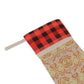 A one-sided print Christmas stocking with a red and black plaid design and a William Morris & Co floral pattern in orange and green tones. It has a beige background and a polyester cuff.