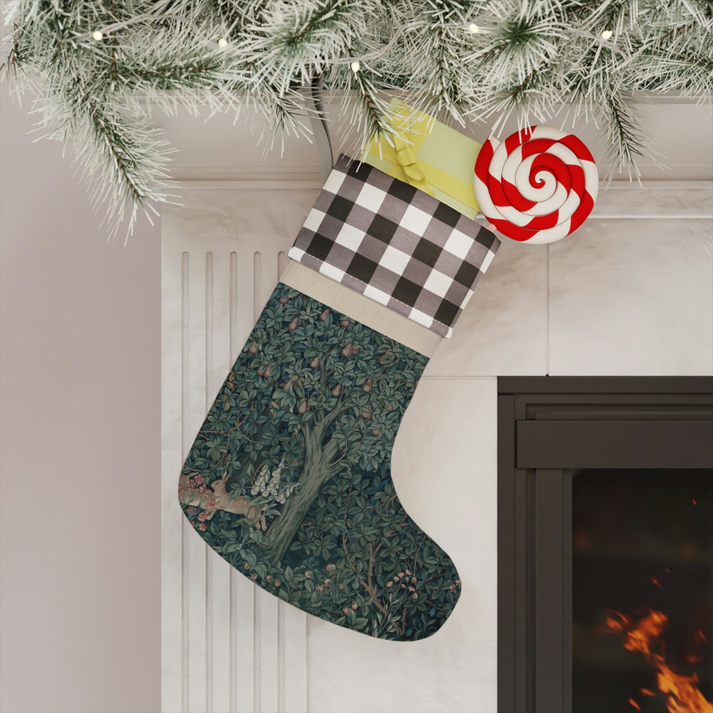 A Christmas stocking with a red and black plaid design at the top and a green and white floral design in the bottom. It features an animal (rabbit) and has a hanging loop.