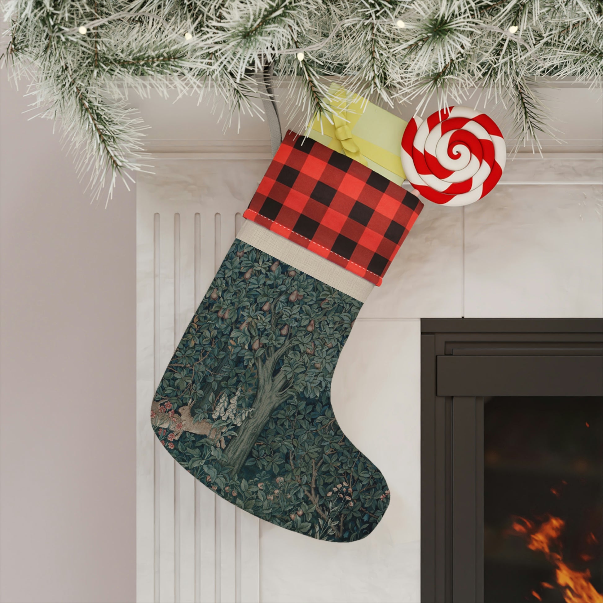 A Christmas stocking with a red and black plaid design at the top and a green and white floral design in the bottom. It features an animal (rabbit) and has a hanging loop.