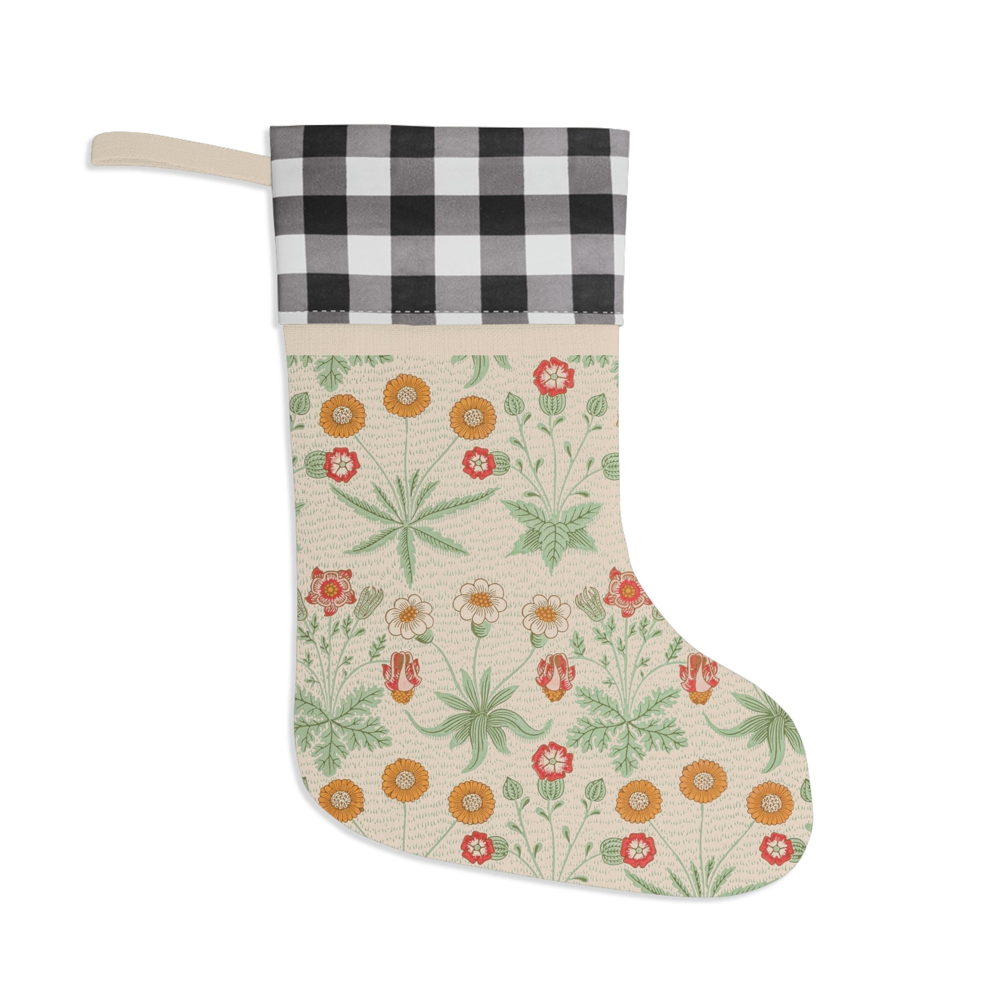 A Christmas stocking with a floral pattern in red and green colors, featuring a red and black checkered cuff at the top.