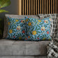 Cushion Cover in a floral pattern by William Morris & Co called Four Fruits Collection (Sky) in blue, green, red and yellow