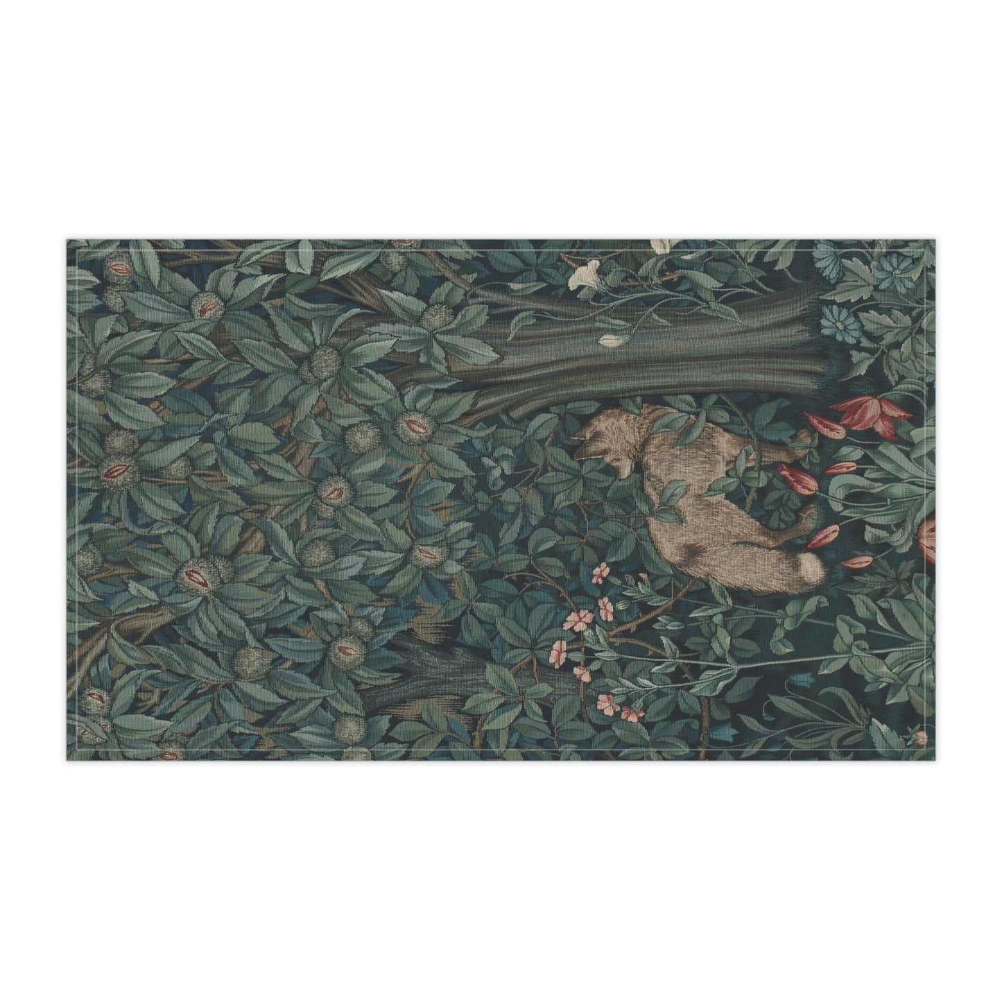 A kitchen tea towel featuring an artistic design with green foliage and a fox among the leaves.