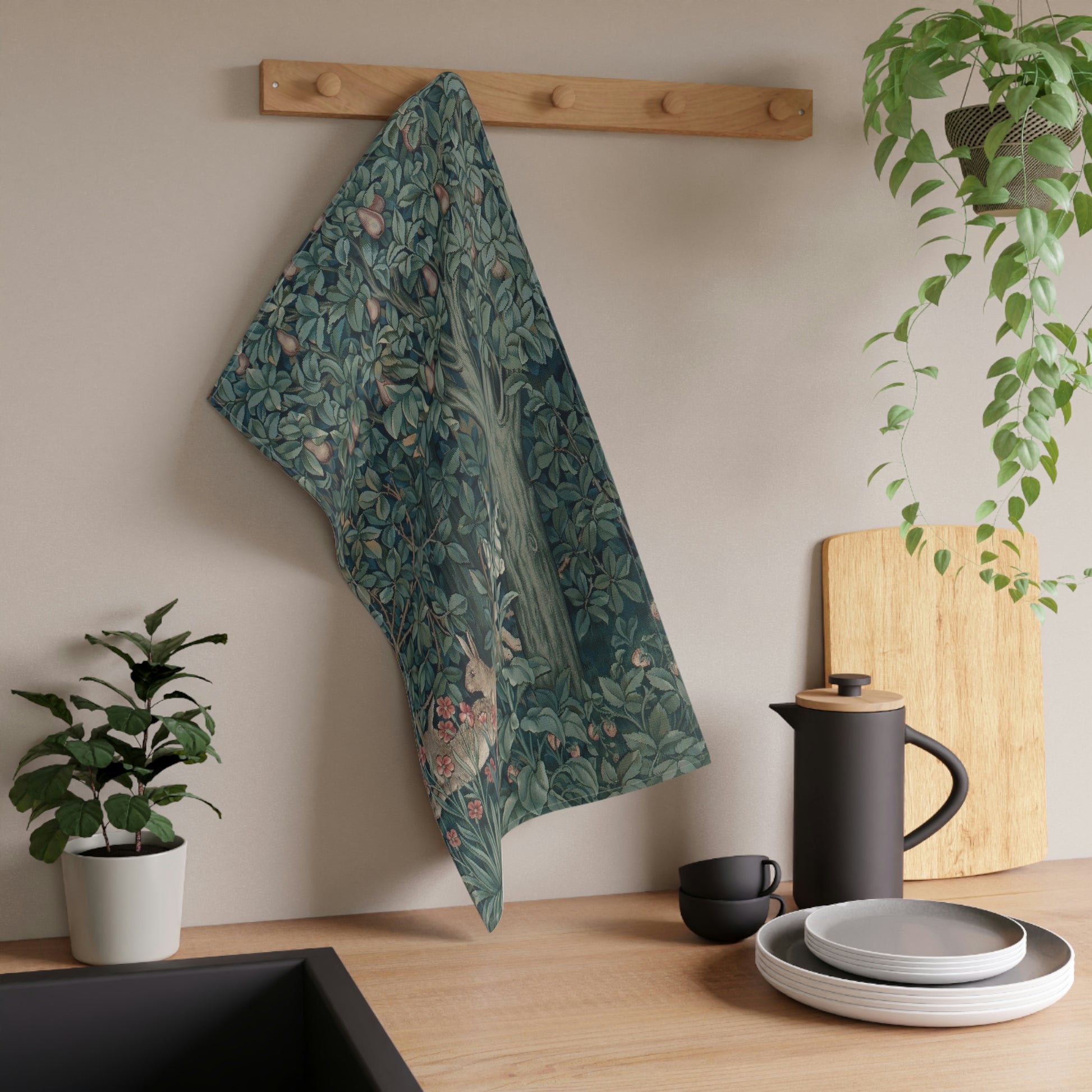 A kitchen tea towel featuring an artistic design with a rabbit among leaves and a tree, inspired by the William Morris - Greenery Collection.