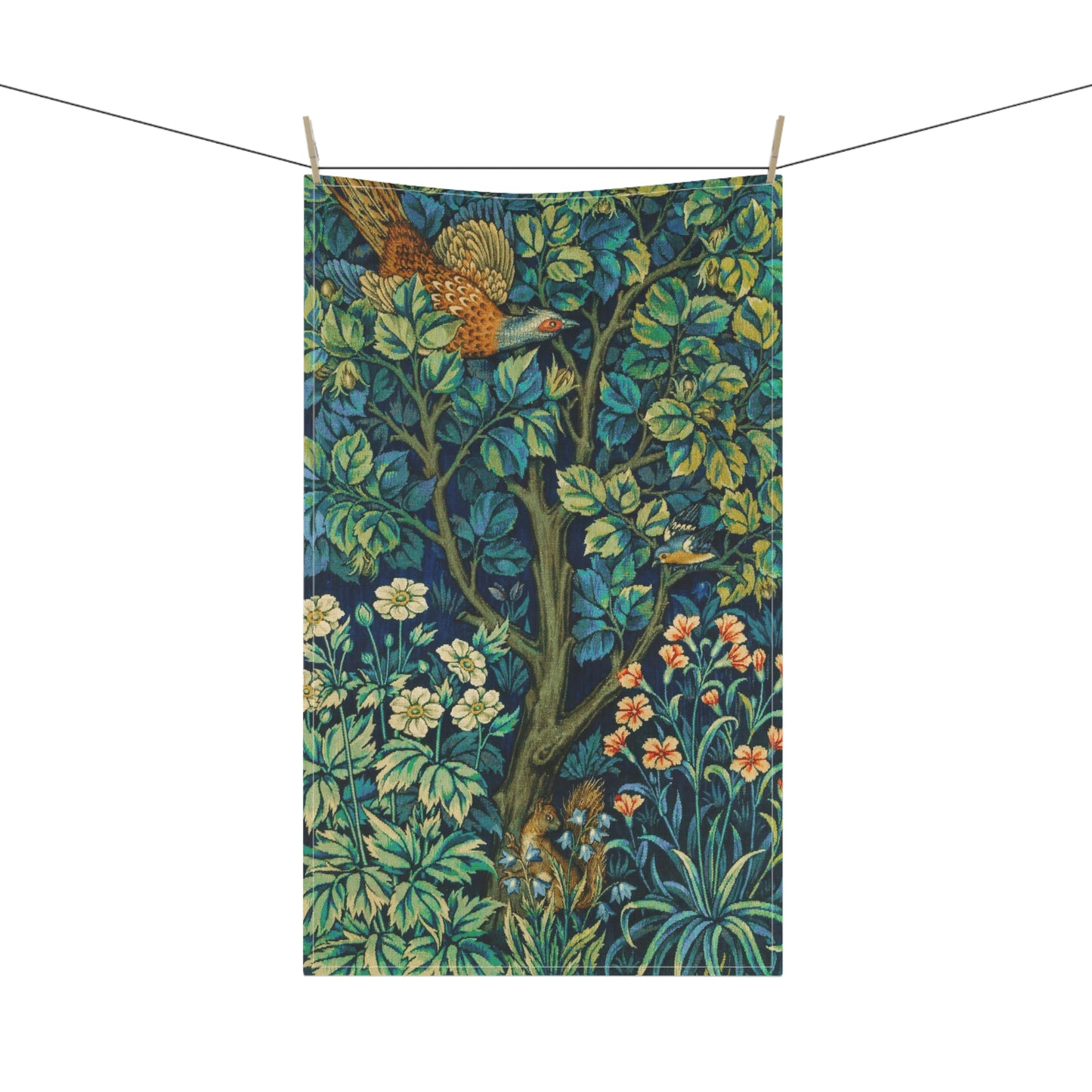 A kitchen tea towel featuring an artistic design with pheasants, squirrels, and floral elements on a blue background.