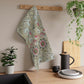 A kitchen tea towel with a floral pattern inspired by William Morris - Corncockle Collection.