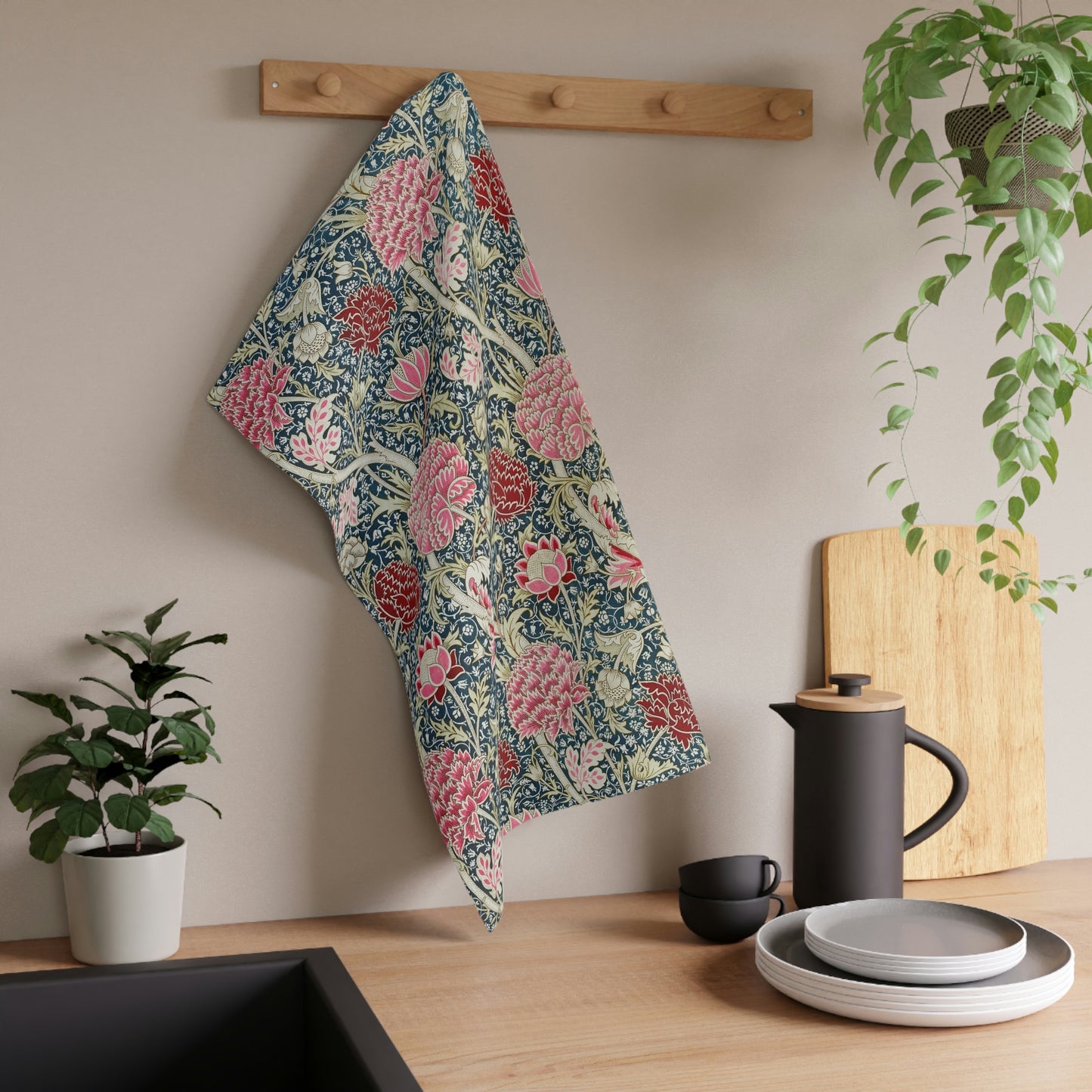 A kitchen tea towel with a floral pattern inspired by William Morris - Cray Collection, featuring predominantly blue, pink and red colours.