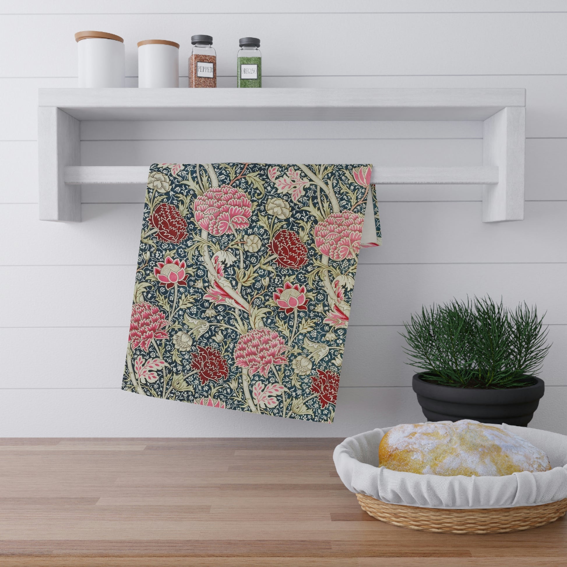 A kitchen tea towel with a floral pattern inspired by William Morris - Cray Collection, featuring predominantly blue, pink and red colours.