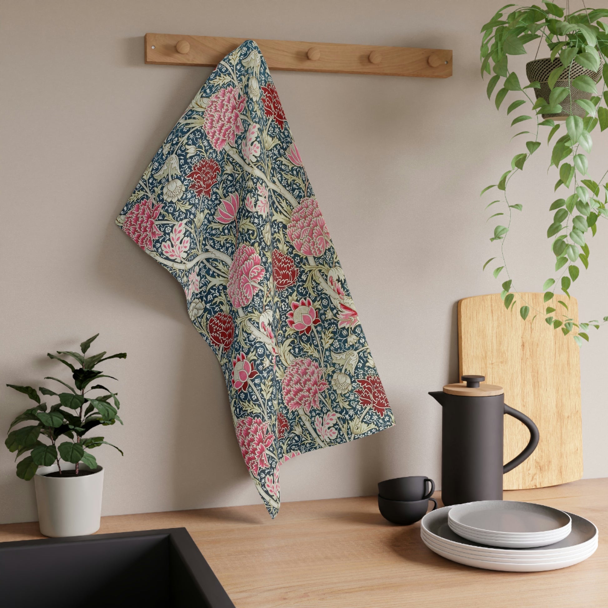A kitchen tea towel with a floral pattern inspired by William Morris - Cray Collection, featuring predominantly blue, pink and red colours.
