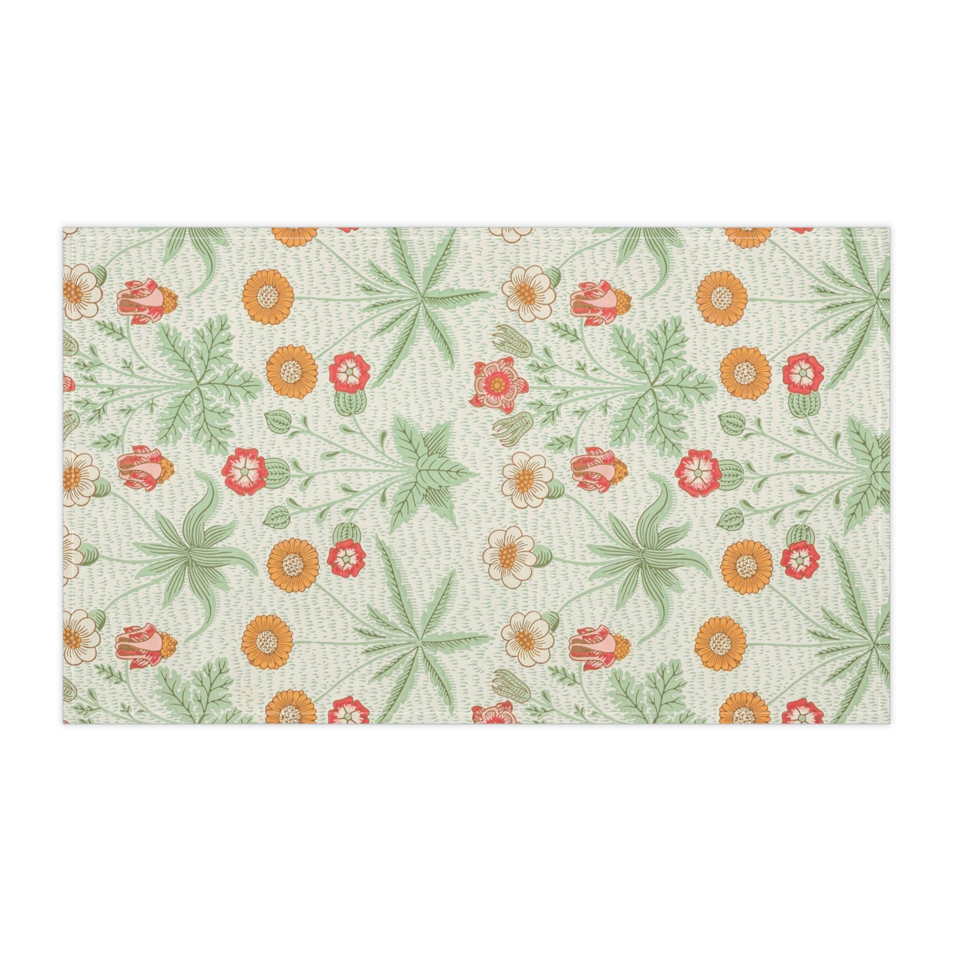 A kitchen tea towel featuring a floral William Morris & Co pattern with prominent orange and green colours on a white background.