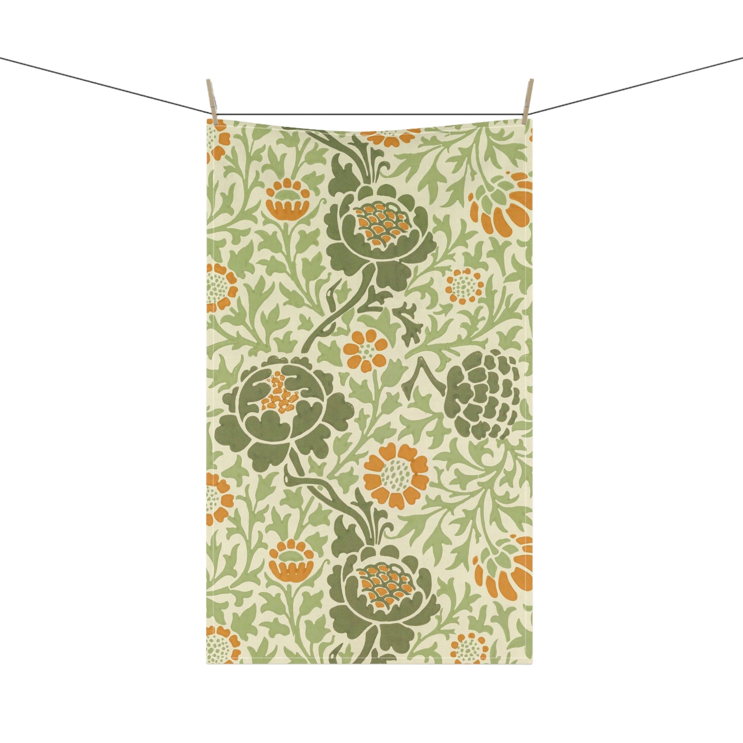 A kitchen tea towel with a floral William Morris & Co pattern featuring green, orange and yellow colours on a light background.