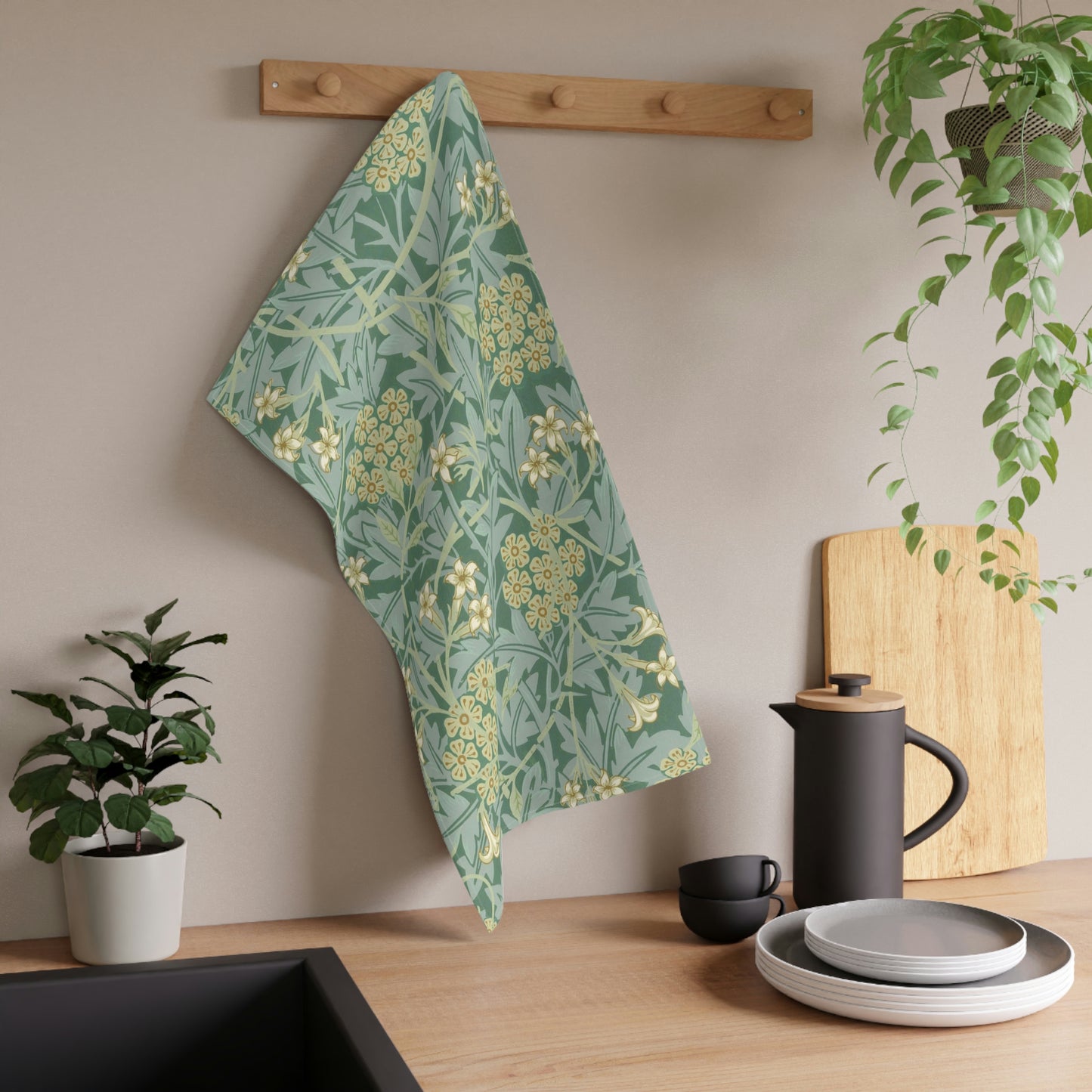 A kitchen tea towel with a green floral pattern inspired by William Morris & Co- Jasmine Collection.