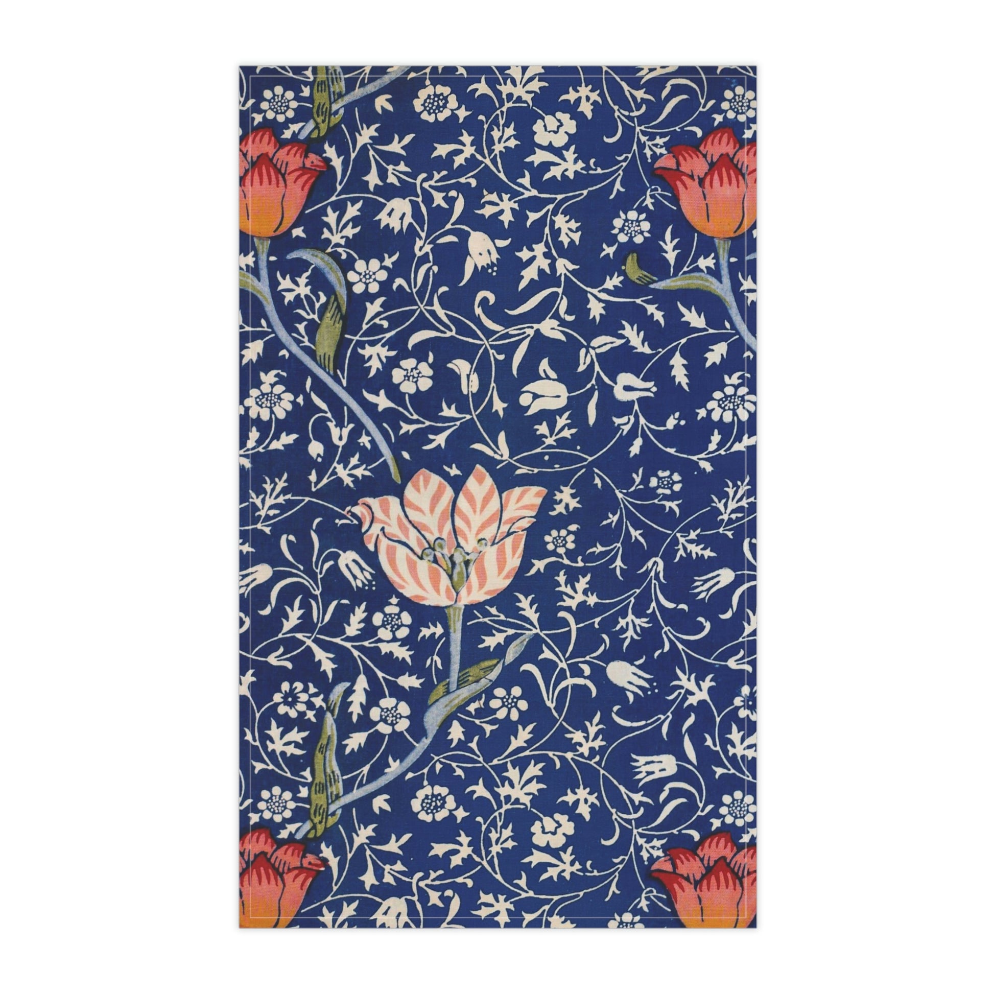 A kitchen tea towel with a blue background featuring William Morris & Co floral and geometric Art Nouveau patterns.