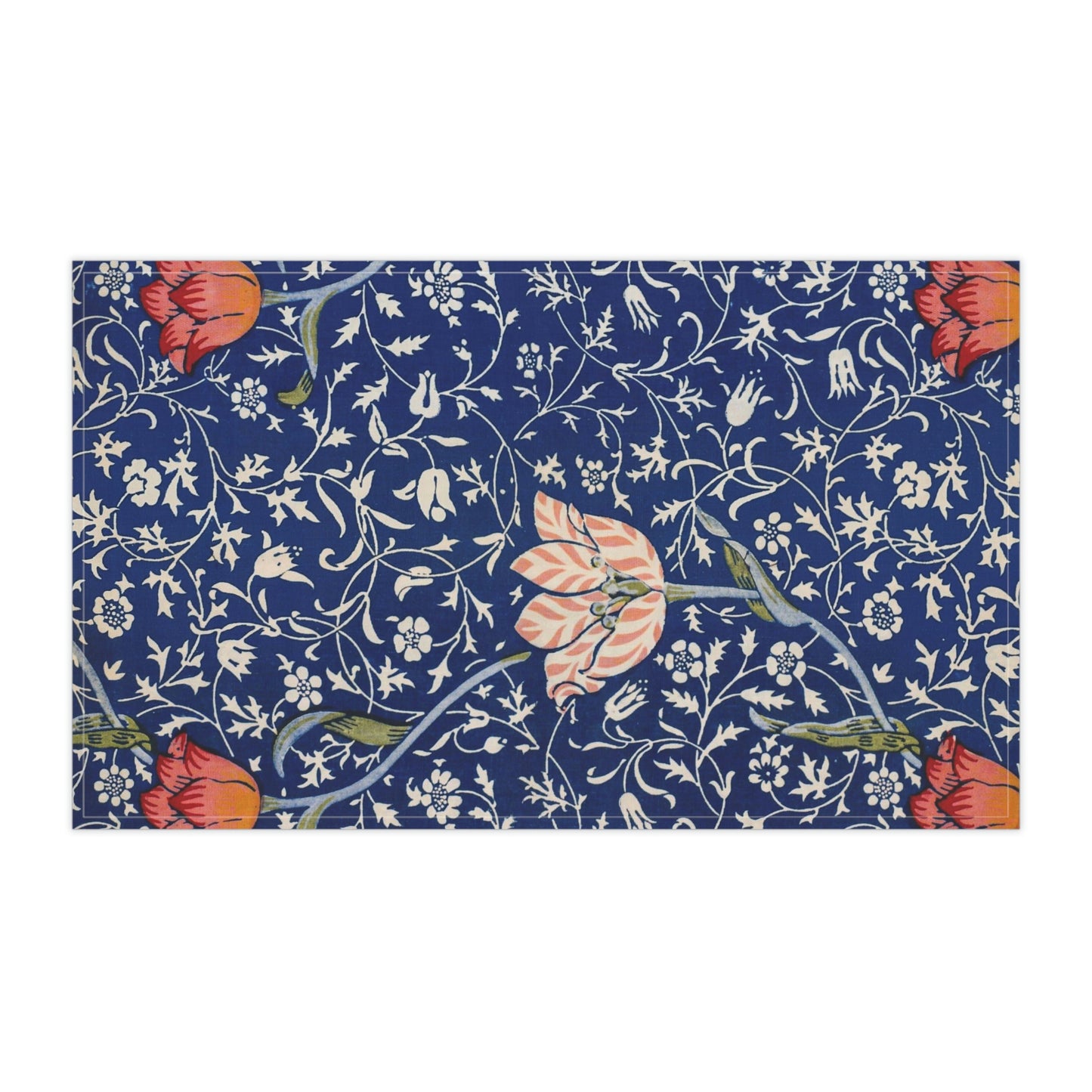 A kitchen tea towel with a blue background featuring William Morris & Co floral and geometric Art Nouveau patterns.
