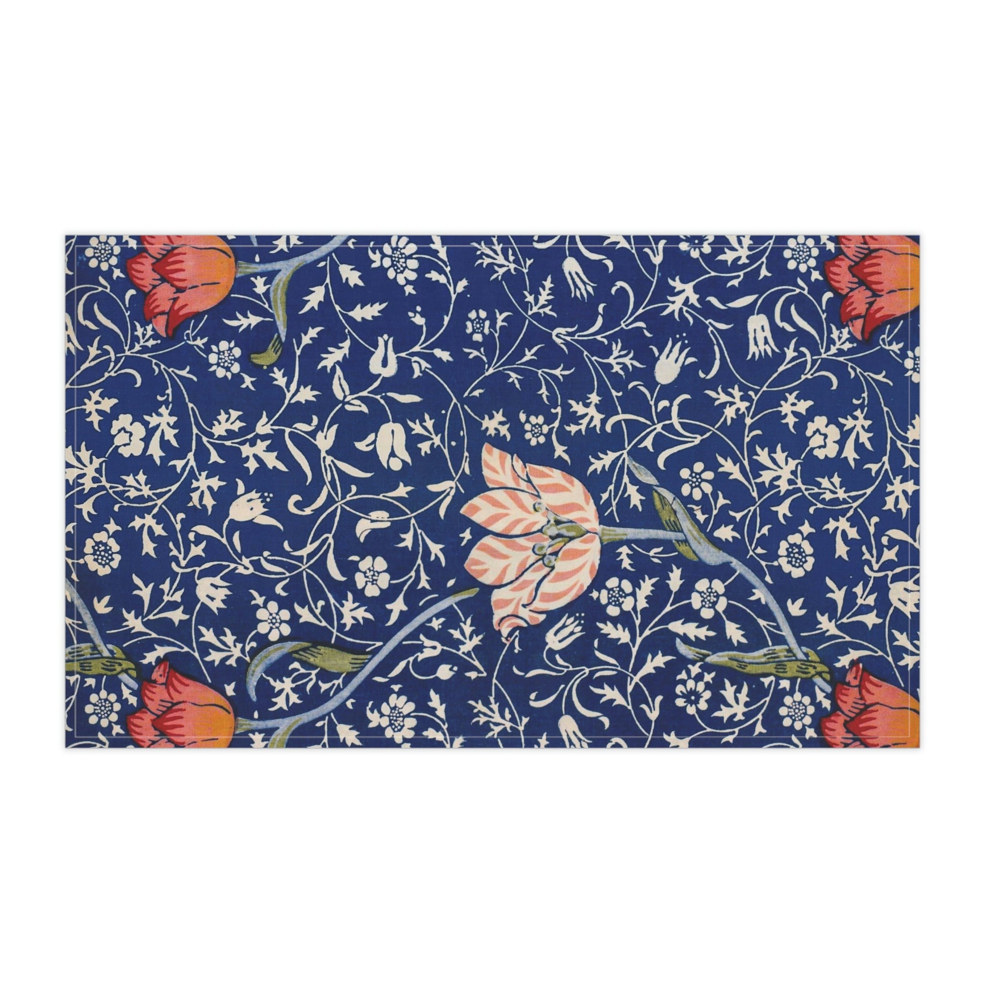 A kitchen tea towel with a blue background featuring William Morris & Co floral and geometric Art Nouveau patterns.