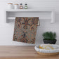 A kitchen tea towel with a floral and geometric pattern in multiple colours, inspired by William Morris - Pomegranate Collection.