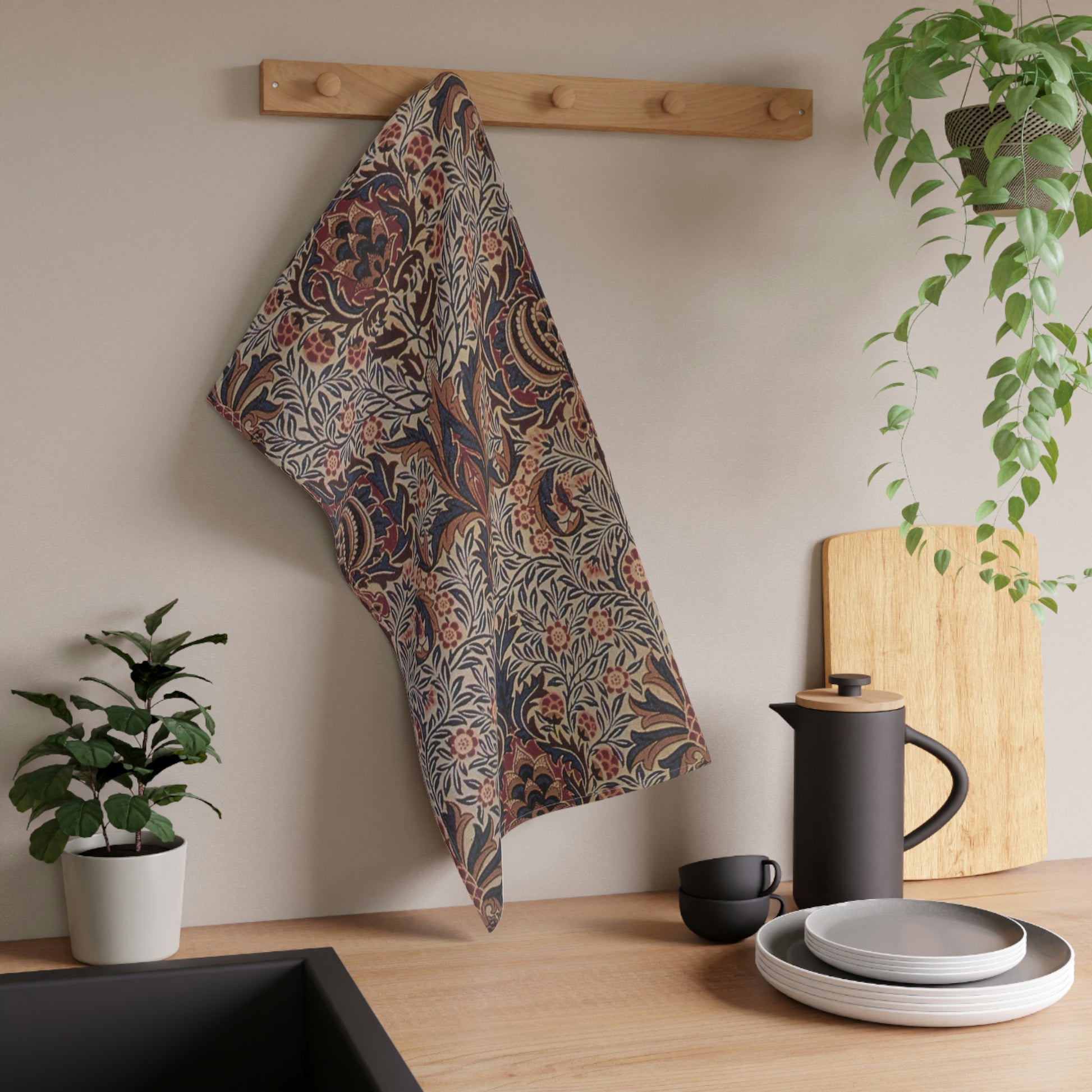 A kitchen tea towel with a floral and geometric pattern in multiple colours, inspired by William Morris - Pomegranate Collection.