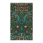 A kitchen tea towel with a floral pattern inspired by William Morris, featuring tulips in red and blue on a dark green background.