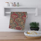 A kitchen tea towel with a red floral pattern inspired by William Morris - Wandle Collection.