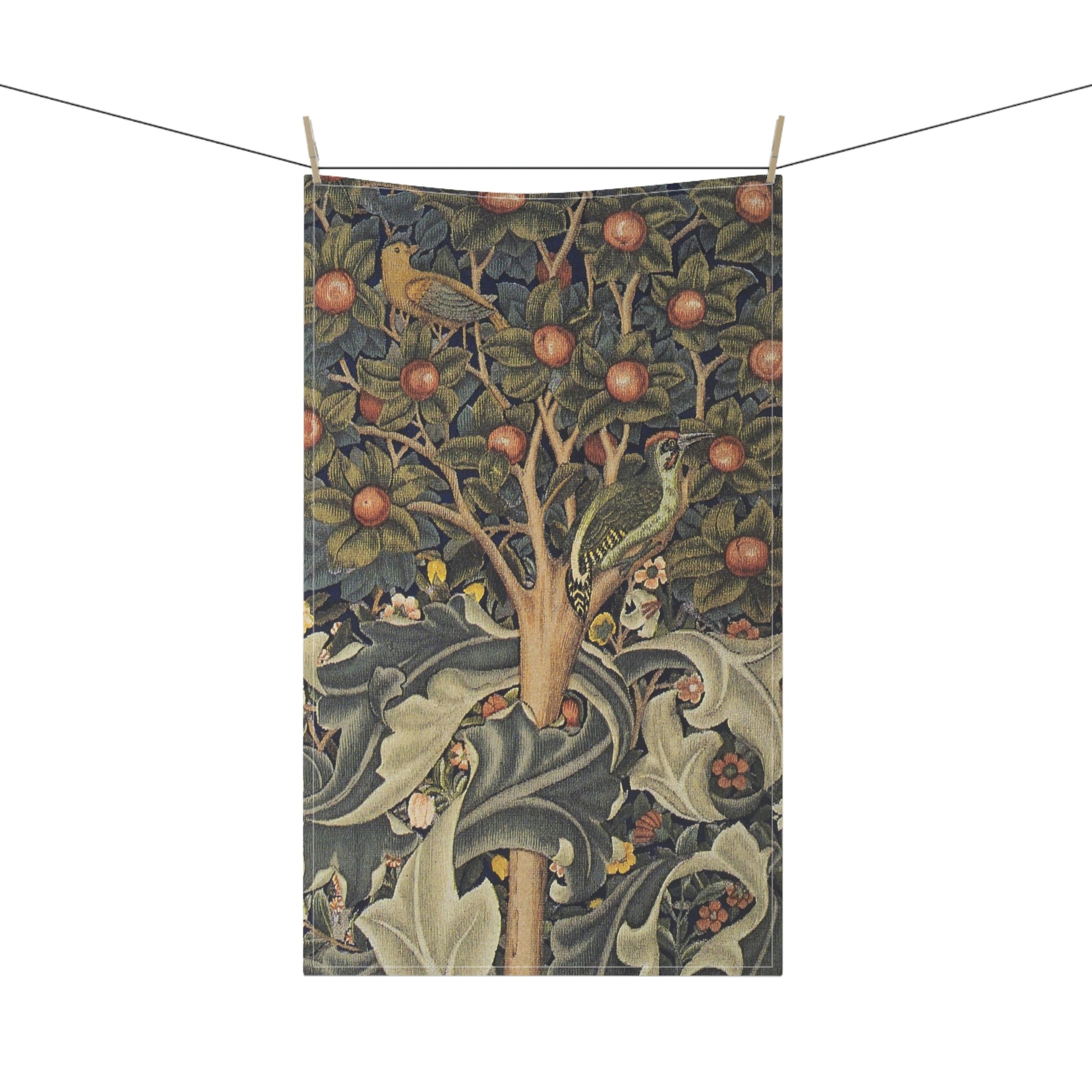 A kitchen tea towel featuring an artistic William Morris & Co design with birds, flowers, and leaves on a green background.