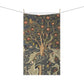 A kitchen tea towel featuring an artistic William Morris & Co design with birds, flowers, and leaves on a green background.