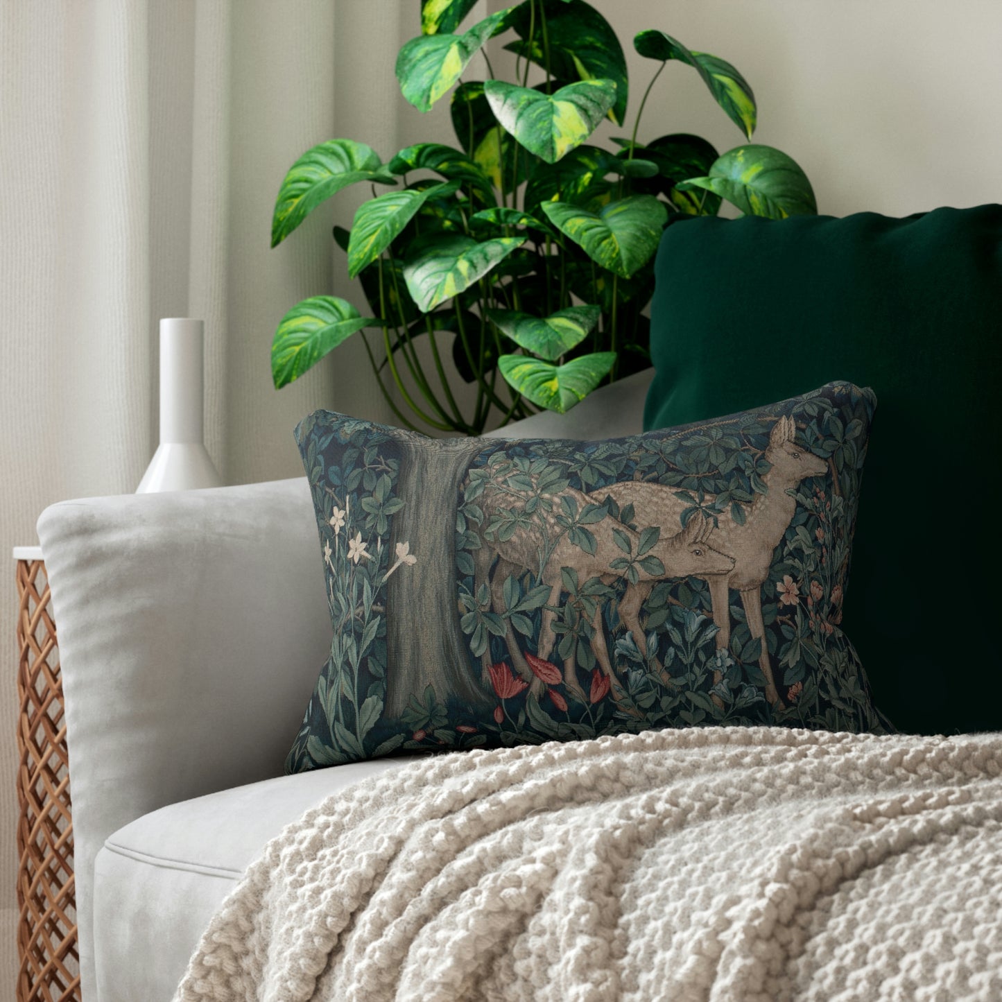 A lumbar cushion featuring an intricate woven design with a deer and forest motif, inspired by William Morris - Greenery Collection.