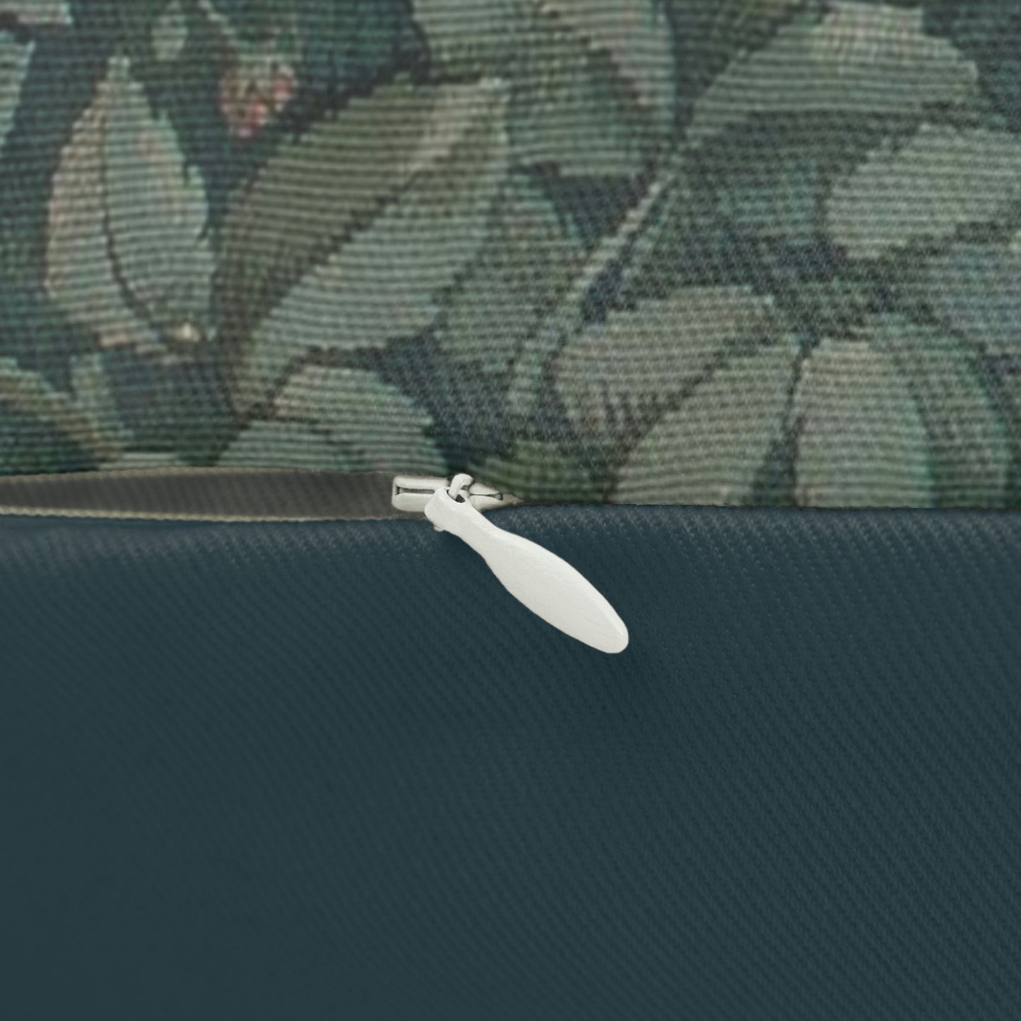 A rectangular lumbar cushion with a green and brown design featuring a rabbit, trees, and floral elements, inspired by William Morris - Greenery Collection.