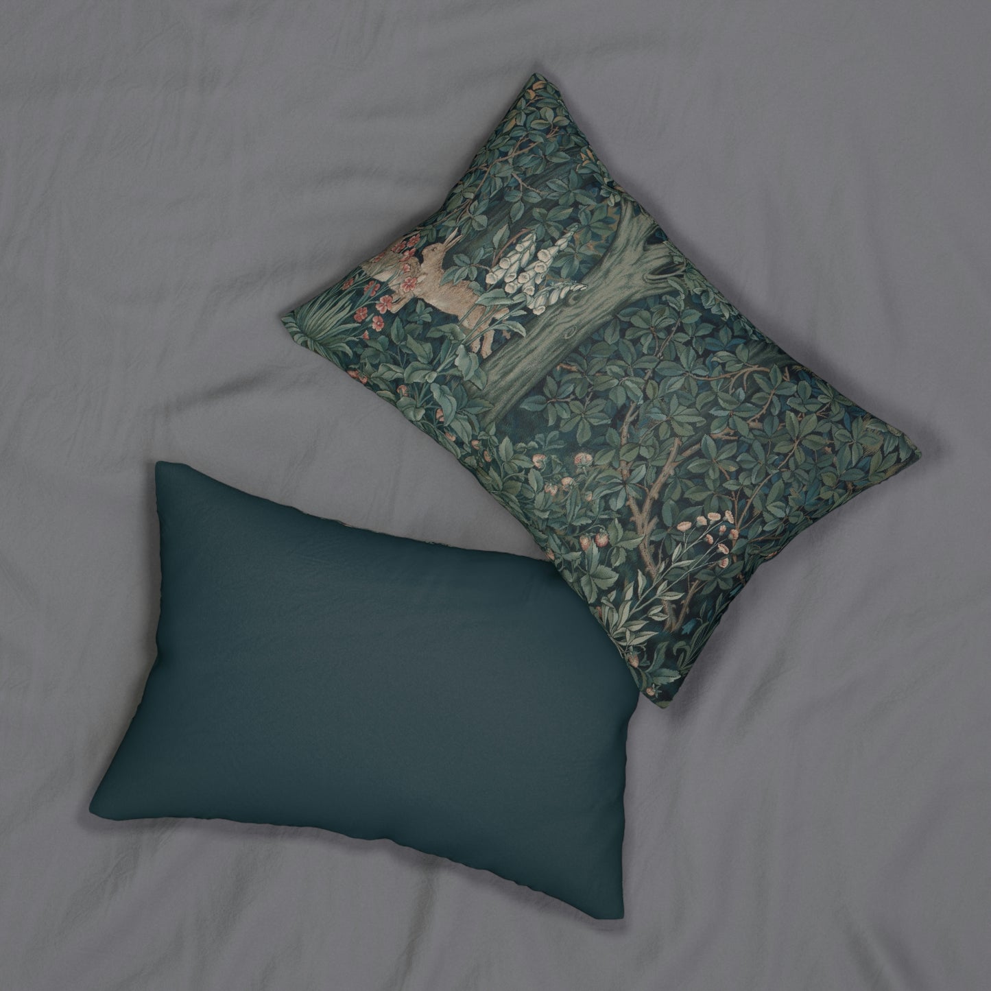 A rectangular lumbar cushion with a green and brown design featuring a rabbit, trees, and floral elements, inspired by William Morris - Greenery Collection.