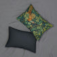 A lumbar cushion featuring a hidden beige zipper with a William Morris & Co design of a pheasant among green leaves on a background with a similar leaf pattern.
