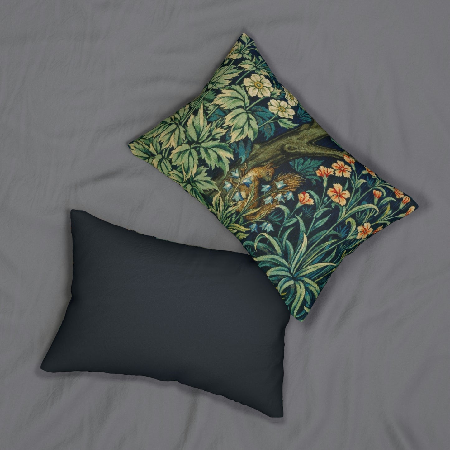 A lumbar cushion with a William Morris & Co floral and animal print design, featuring a tree and squirrel, on a white background.