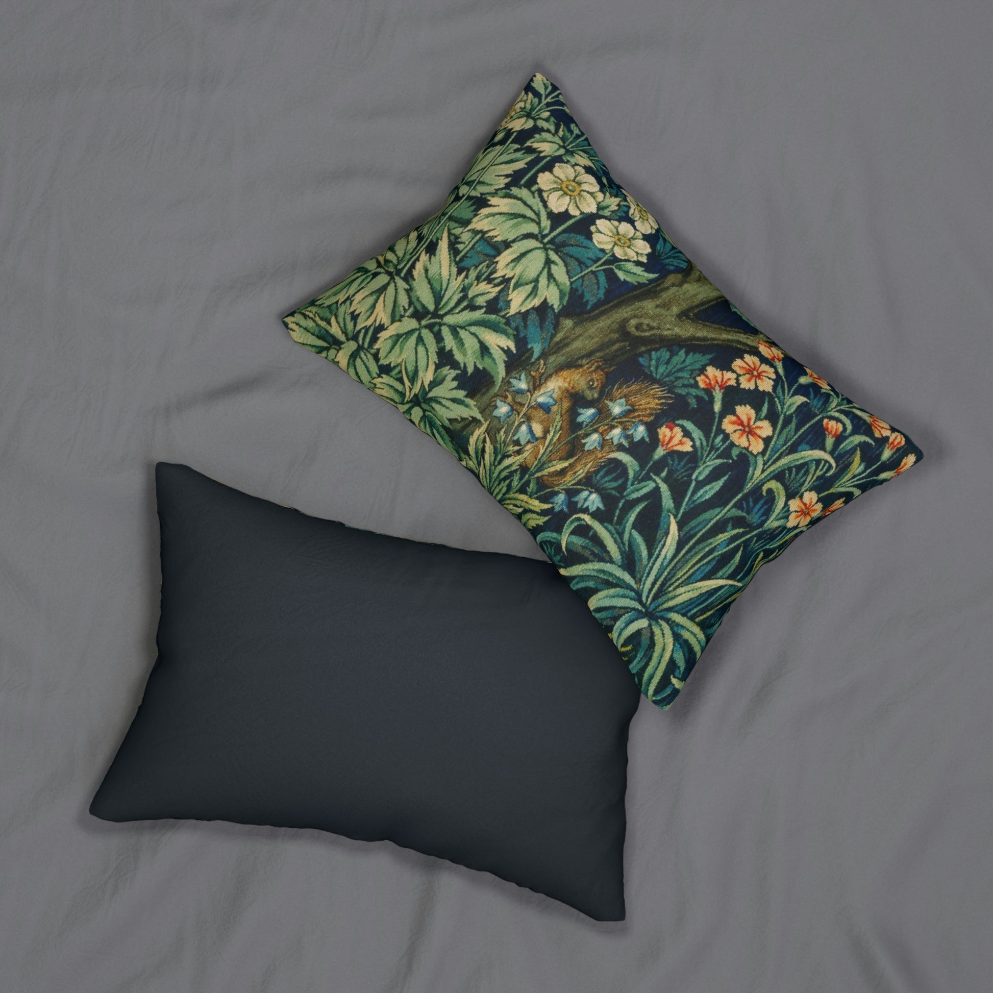 A lumbar cushion with a William Morris & Co floral and animal print design, featuring a tree and squirrel, on a white background.