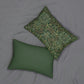 A rectangular lumbar cushion with a floral William Morris & Co pattern design in green, beige, and brown colours, featuring a concealed beige zipper.