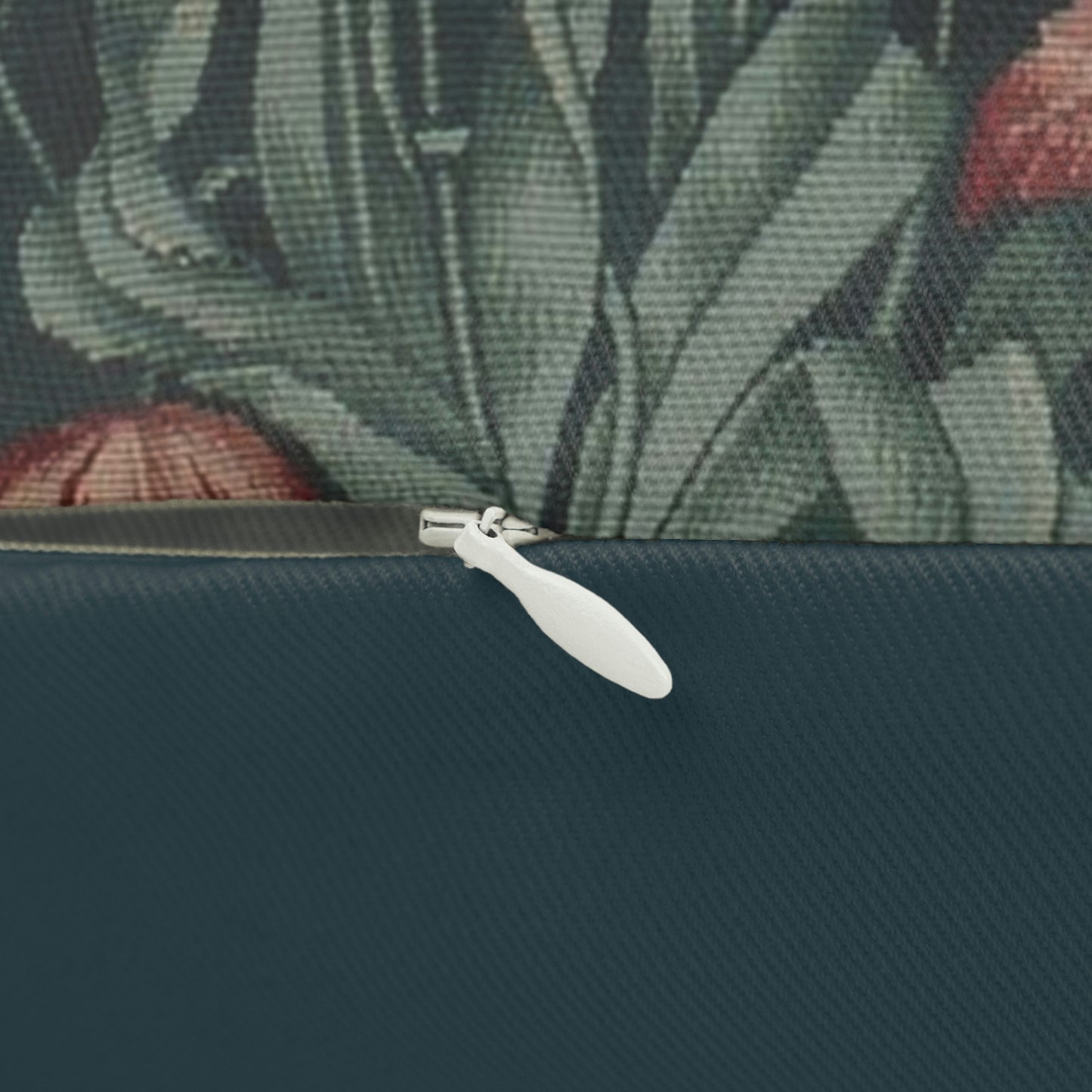 A rectangular lumbar cushion with a floral pattern featuring a bear, designed by William Morris & Co, in a forest green colour.